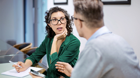 Professionals discussing strategy in meeting room