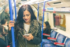 Young Indian Woman Mobile Phone London Tube