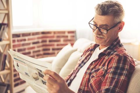 Older Hipster White Man With Glasses Moustache And Papers In Check Shirt